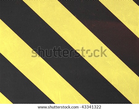 Reflective yellow and black stripes on a traffic sign