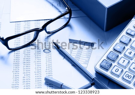 Financial statements glasses and calculator