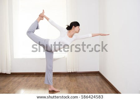 Beautiful Asian women to practice yoga in the room
