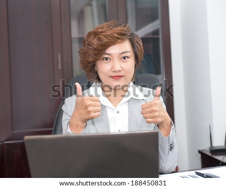 Business woman thumbs up with both hands, praised the success