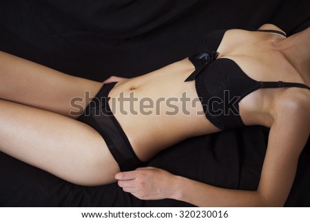Sexy Girl's Body. Closeup Of Beautiful Fit Young Woman's Body With Perfect  Body Shape And Hand Touching And Covering Her Breast. Slim Topless Female  In Bikini Panties. Beauty Concept. High Resolution Stock