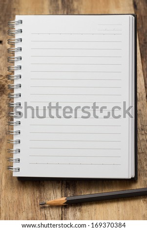 Paper page notebook. textured isolated on the wood backgrounds