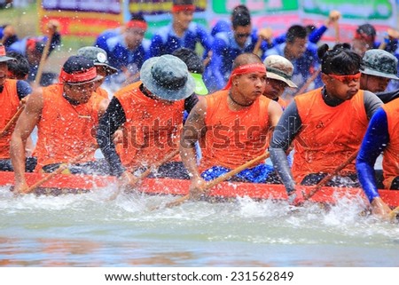 SAMUTSAKHON, THAILAND - OCT 16: View of rowing team in full speed during Thai Long Boat Racing Competition for Royal Championship Cup on October 16,2014 in Samutsakhon,Thailand.