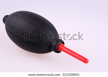 Silicone blower for camera and lenses - Rubber Air Blower Pump Dust Cleaner for Camera isolated on white background