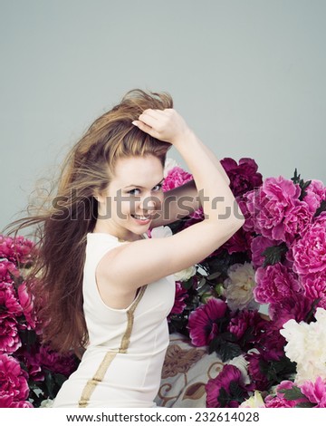 Beautiful Young Woman Lifts Hands Hair
