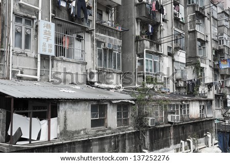 HONG KONG - MARCH 18 :Crowded residential in old district on March 18, 2013 in Hong Kong. With land mass of 1104 km and 7 million people, Hong Kong is one of most densely populated areas in the world
