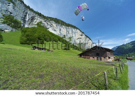 Para glider fly over Lauterbrunnen valley, Switzerland.