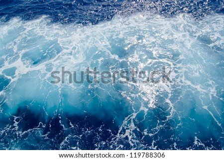 Foamy surface of sea water, shot in the open sea directly from above
