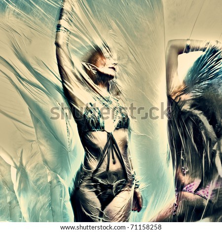 Dancing girl. Polyethylene film disco party. Art photo