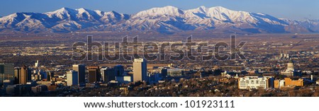 This is Utah\'s State Capitol with the Great Salt Lake and snow capped Wasatch Mountains in morning light.