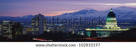 This is Utah\'s State Capitol, Great Salt Lake and Snow Capped Wasatch Mountains at sunset.
