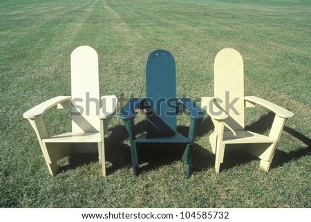 Three lawn chairs on lawn, Middlebury College, VT