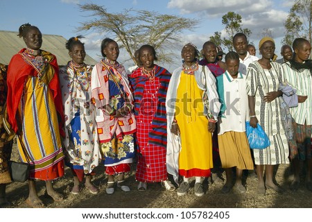 JANUARY 2005 - Village people singing at sunset in village of Nairobi National Park, Nairobi, Kenya, Africa