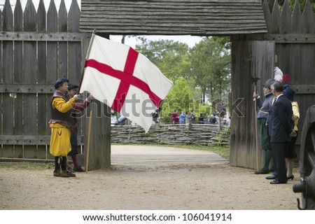 Actor holding English Flag bearing the Cross of St. George at gates of James Fort, Jamestown Settlement, re-creation of the first English Colony in the New World, Virginia on May 4, 2007.