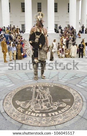 American Indian posing in front of Virginia State Capitol, Richmond Virginia and State Seal during ceremonies for the 400th Anniversary of the Jamestown Settlement on May 3, 2007
