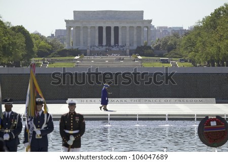 Her Majesty Queen Elizabeth II walking the National World War II Memorial with the Lincoln Memorial in the background, Washington, DC, May 8, 2007