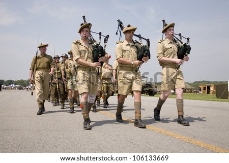 World War Ii Reenactment Of Marching Troops Playing Bagpipes Of Great ...