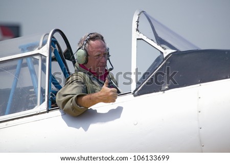 Pilot giving thumbs-up in his North American SNJ-4 Ã?Â� SNJ-6 fighter plane from World War II, Mid-Atlantic Air Museum World War II Weekend and Reenactment in Reading, PA held June 18, 2008