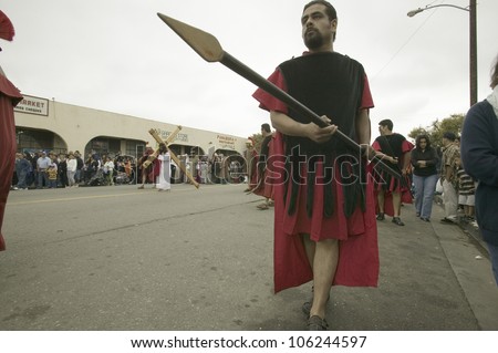 Roman soldiers with spears marching down street on Good Friday, Easter, as part of the Passion play, Oxnard, California, April 6, 2007.