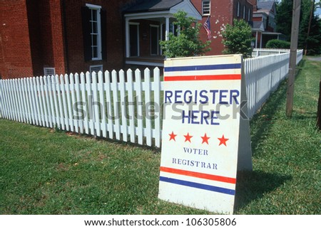 CIRCA 1998 - Voter registration sign with white picket fence, Buckingham, Virginia