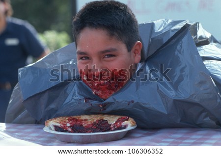 CIRCA 1999 - Boy at Pie Eating Contest, Knott\'s Berry Farm, Los Angeles, California