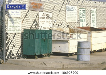 CIRCA 1992 - Informational signs to drop-off areas for recycling at Santa Monica Recycling Center, CA