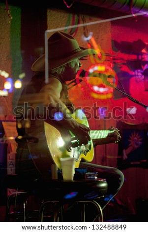 NASHVILLE - DECEMBER 03: Country singer performs in the window of Lower Broadway bar on December 03, 2012 in Nashville, Tennessee, USA