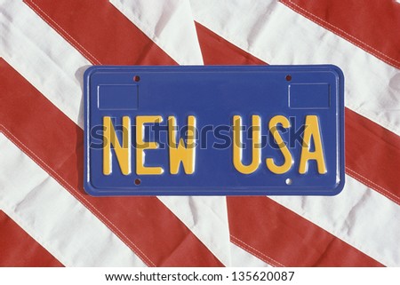 New USA license plate on stripes of American flag