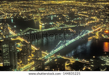 Brooklyn Bridge and Manhattan Bridge in New York City at night, NY
