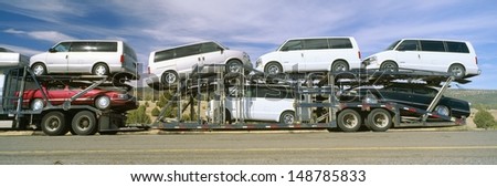 CALIFORNIA DESERT - CIRCA 1990\'s: Auto Transporter, GM Vans, Route 40, Arizona, USA