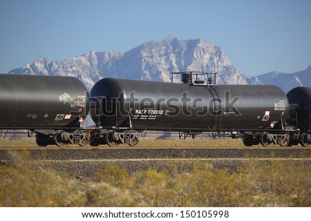 MOJAVE DESERT, CA - JULY 29: Freight train travels through desert and mountainous areas of Mojave Desert on July 29, 2004 in Southern California