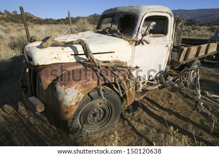 CUYAMA CALIFORNIA - CIRCA 2007: Deserted truck in field off highway 33, near Cuyama California