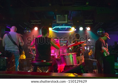 NEW ORLEANS, LOUISIANA - CIRCA 2004: Band preforms in a rock club in French Quarter at night in New Orleans, Louisiana