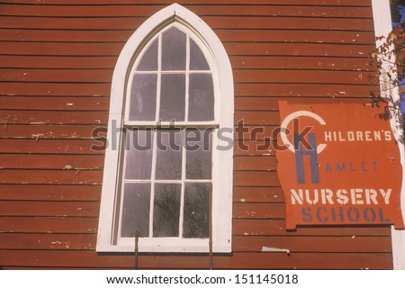 CATSKILLS, NEW YORK - CIRCA 1980\'s: Red nursery school house window, Catskills, NY