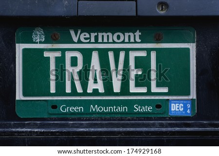 This is a vanity license plate that says TRAVEL. It is a green Vermont license plate. Vermont is the Green Mountain State.