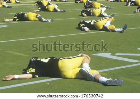 Football Player stretching on field prior to Homecoming Game, West Point, NY