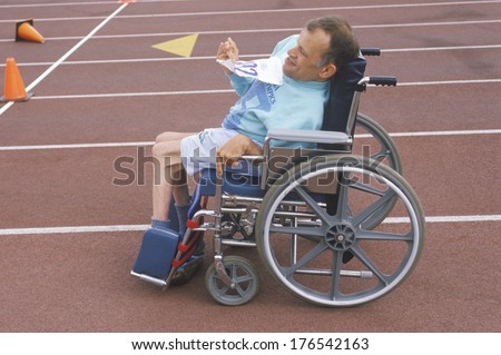 Special Olympics athlete in wheelchair, approaching finish line, UCLA, CA