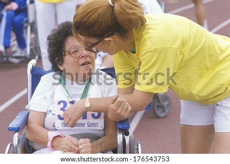 Volunteer coaching wheelchair athlete, Special Olympics, UCLA, CA