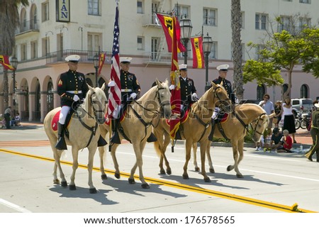 Santa  Barbara\'s Old Spanish Days, Fiesta, August 3-7, 2005 US Marine Color guard on riding horses during opening day parade down State Street, Santa Barbara, California