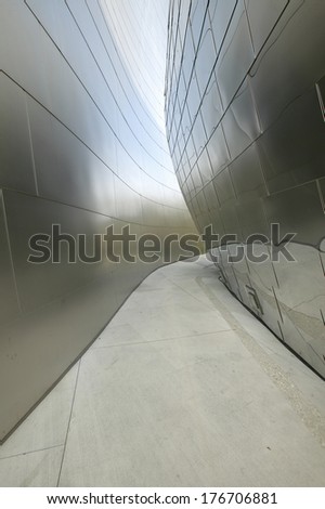Walkway between stainless steel walls of Disney concert Hall, designed by Frank Gehry, in downtown Los Angeles, California