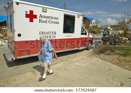 Old man getting bag of ice from Red Cross vehicle in Pensacola Florida after Hurricane Ivan