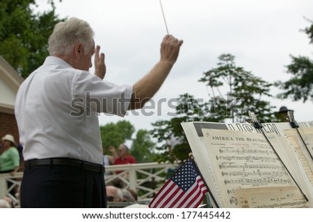 Music conductors conducts musicians for American citizens at Independence Day Naturalization Ceremony on July 4, 2005 at Thomas Jefferson\'s home, Monticello, Charlottesville, Virginia.