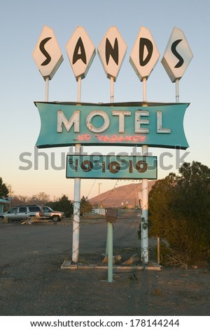 Neon lights come on at sunset at Sands Motel with RV Parking for $10, located at the intersection of Route 54 & 380 in Carrizozo, New Mexico