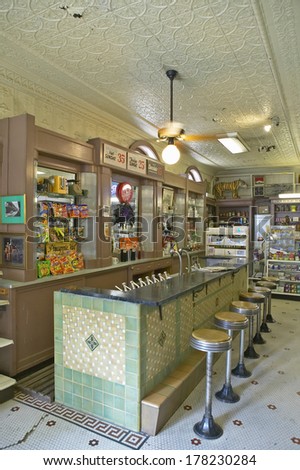 Interior of old drug store with bar stools and soda fountain in French Quarter of New Orleans LA