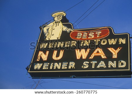 A neon sign that reads \'Best Weiner in Town, Nu Way Weiner Stand\'