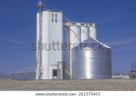 Grain silo co-op in KS with a blue sky in the background
