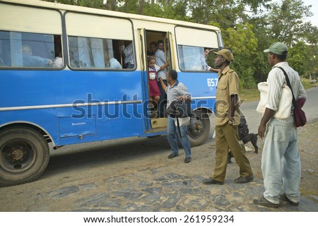 Group of people traveling  in bus in the Valle de Vinales, in central Cuba