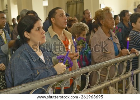 San Lazaro Catholic Church and people praying in El Rincon, Cuba