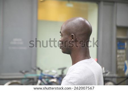 Profile of black man walking down street, Paris, France