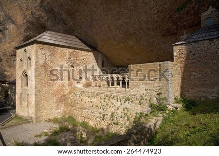 The Monastery of San Juan de la Pena, Jaca, in Jaca, Huesca, Spain, carved from stone under a great cliff. the site of Last Supper \